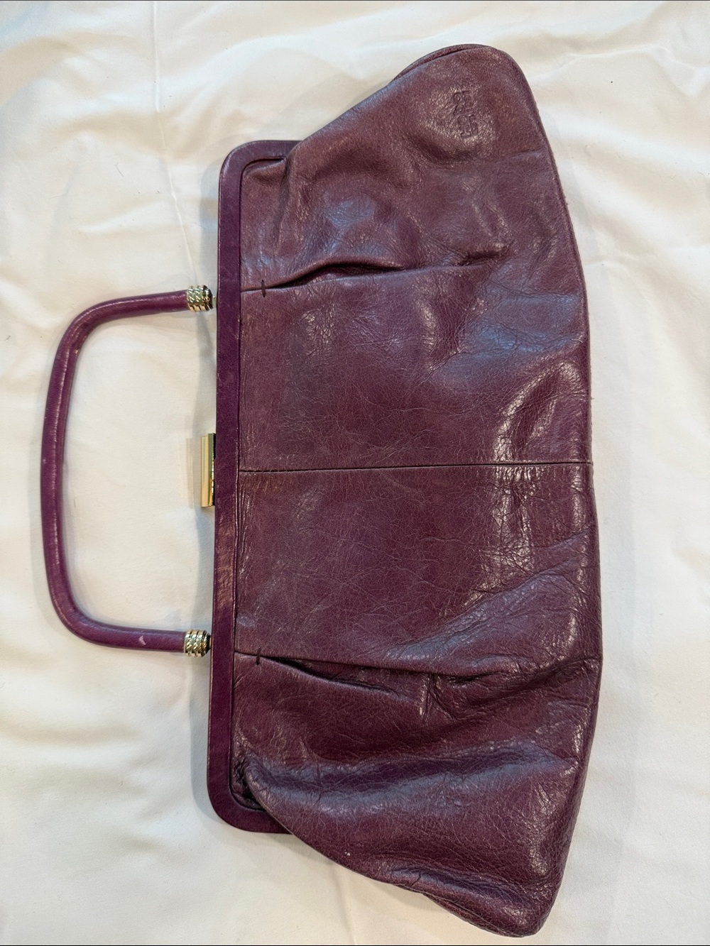 HOBO Plum Leather Top-Handle Clutch with Gold Accent